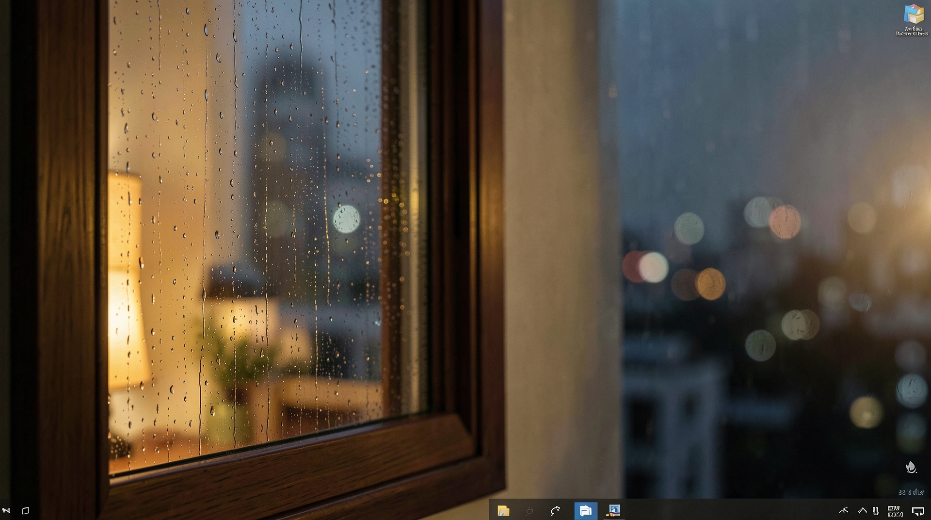 A rainy window at night with cozy lighting