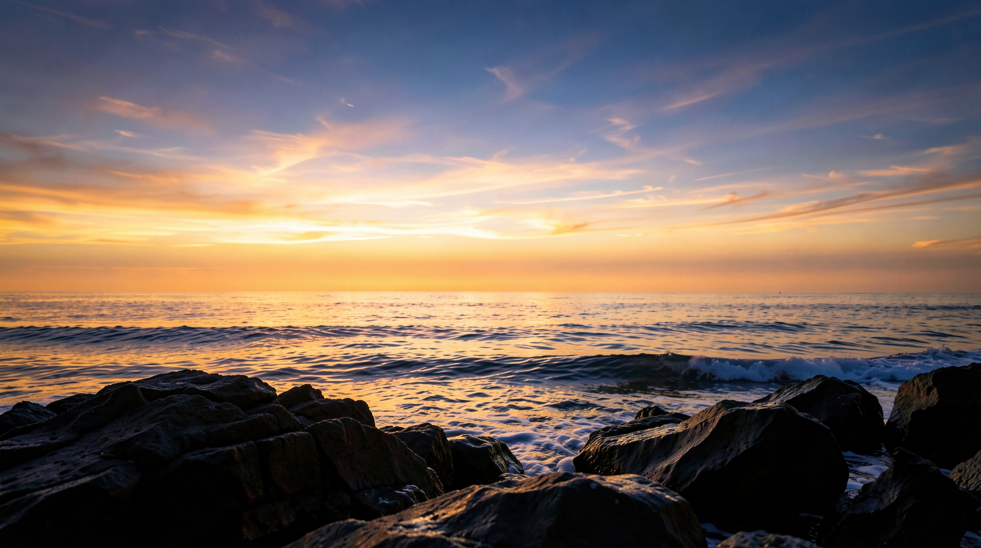 Serene ocean horizon at dusk with warm lighting and gentle waves