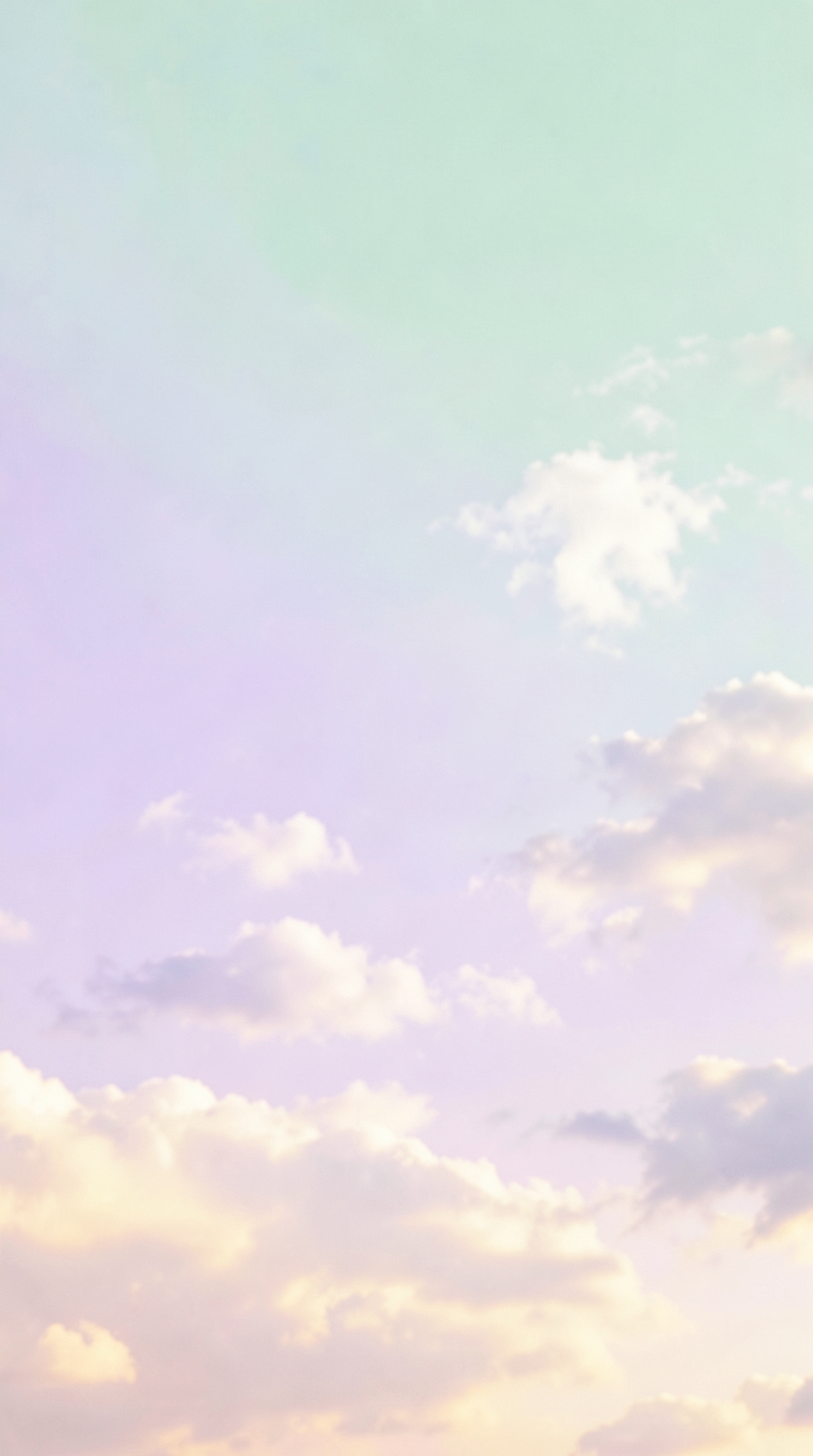 Soft pastel sky with fluffy white clouds and warm lighting