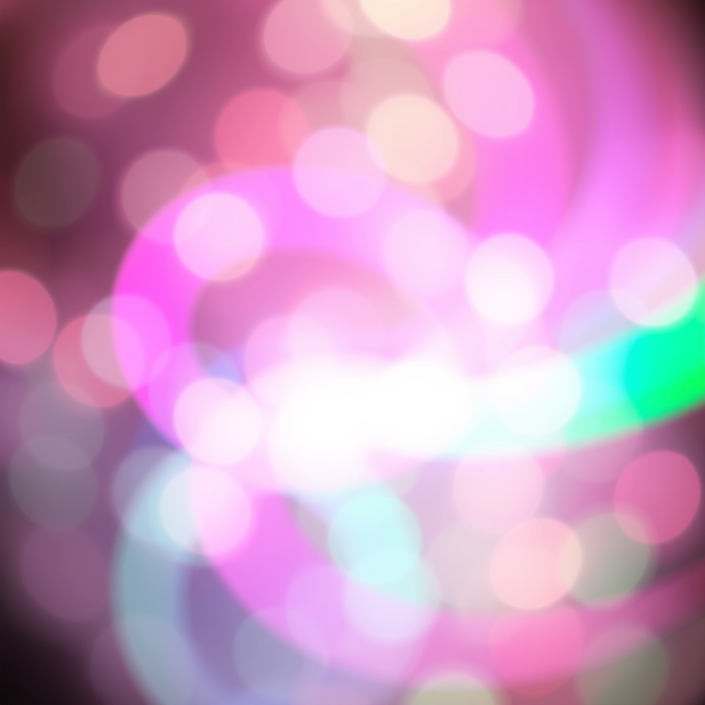 Blurred colorful lights with vibrant pink and green swirls.